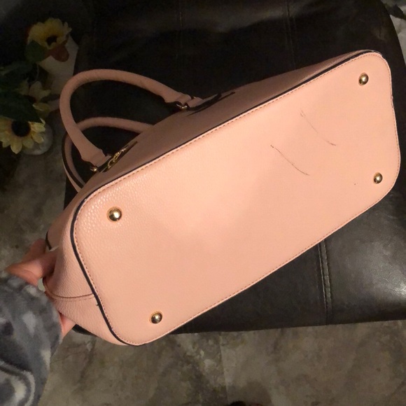 small red stain on front-black marks on bottom - Picture 2 of 2